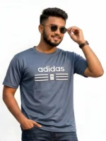 Close up of man wearing an Adidas men's black mesh t-shirt with a raised 3D pumped print logo