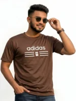 Close up of man wearing an Adidas men's black mesh t-shirt with a raised 3D pumped print logo
