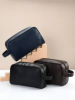 Navy blue, brown, and black leather travel dopp kits flatlay