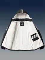 Interior view of a black winter puffer jacket showcasing plush white sherpa lining.