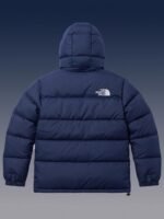 Back view of the navy blue winter puffer jacket showcasing the classic 700-series horizontal insulation baffles.