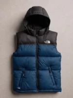 Blue and black colorblock The North Face inspired sleeveless puffer vest featuring a cozy hood and chest logo.