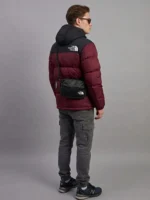 Back view of the premium maroon puffer jacket highlighting the classic black shoulder yoke and hood.