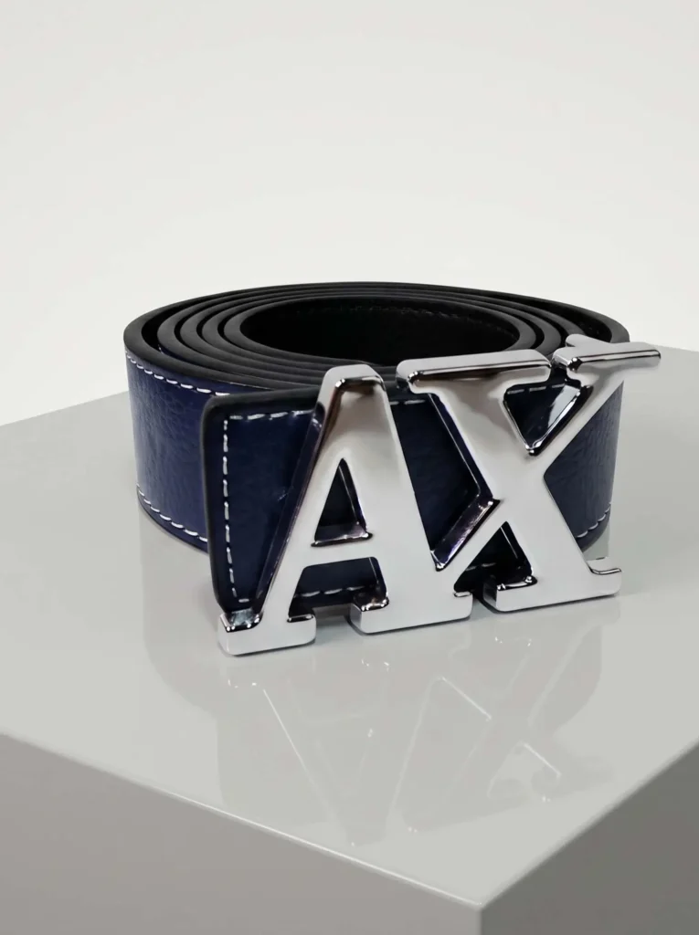 Navy blue AX inspired belt crafted from textured artificial leather featuring a prominent silver logo buckle and contrast stitching.