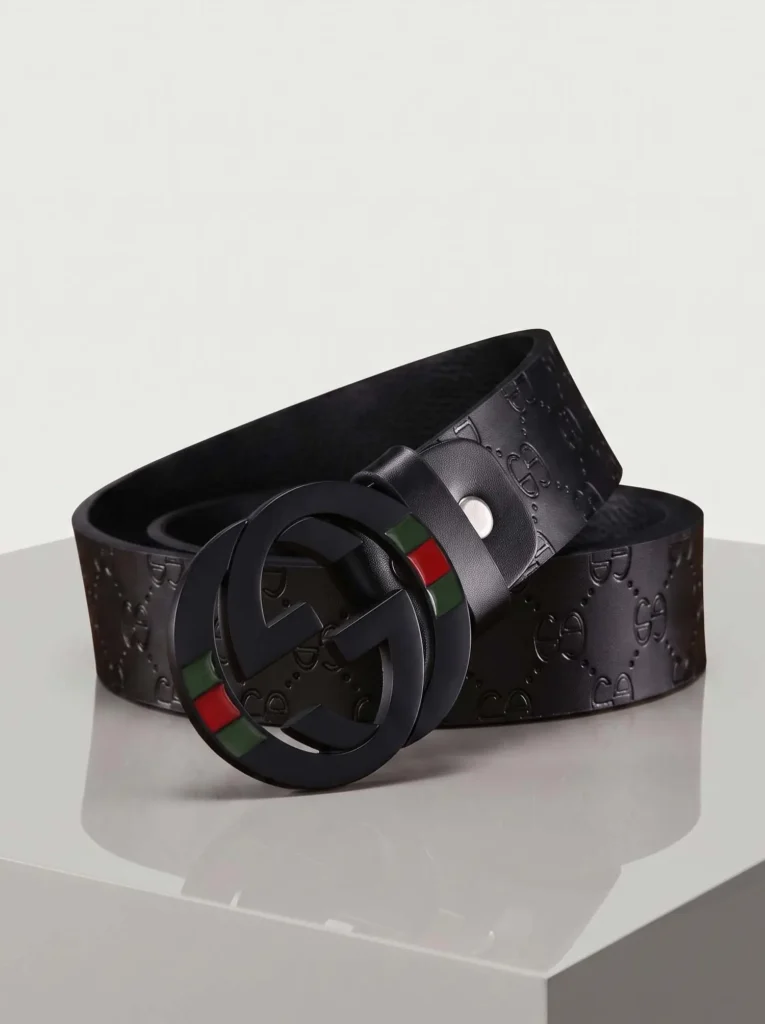 Modern black GC inspired belt featuring a matte black double-G buckle with red and green stripes on a heavily textured artificial leather strap.